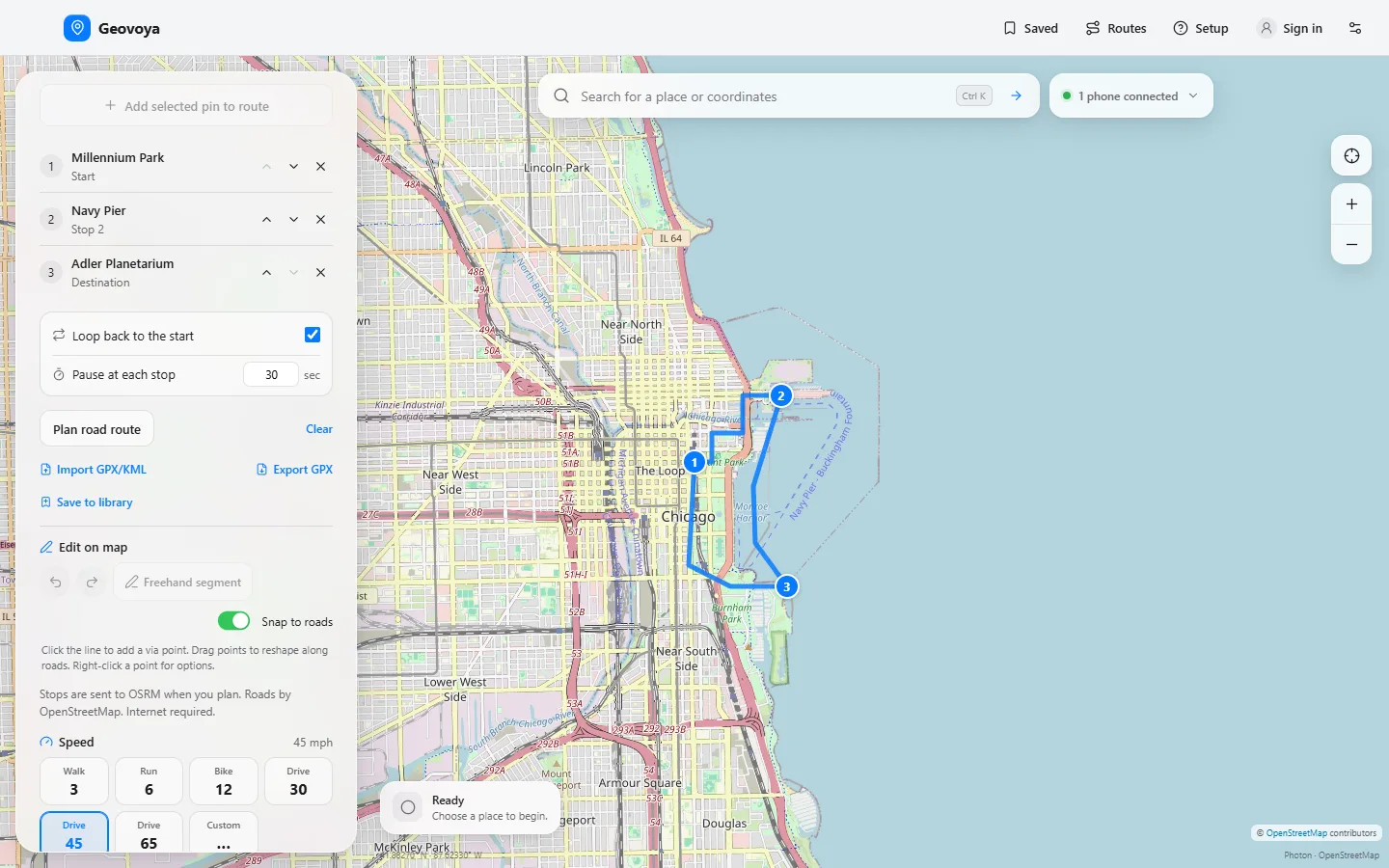 Geovoya in route mode: a three-stop route through downtown Chicago drawn on the map, with the side panel listing Millennium Park, Navy Pier and Adler Planetarium, loop and pause options, GPX import and export, and on-map editing controls.